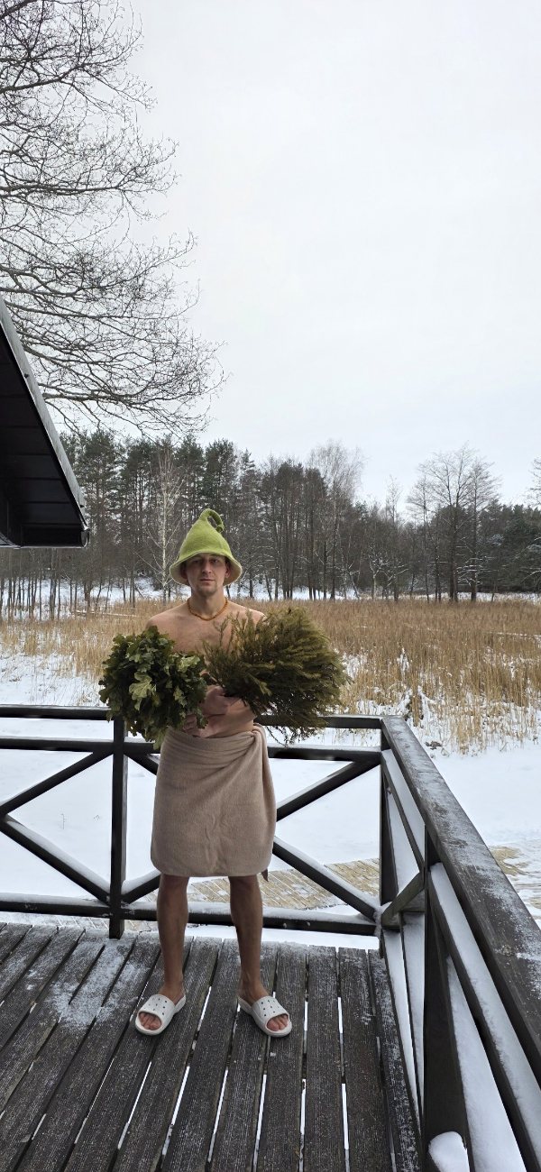 A sauna master with a whisk